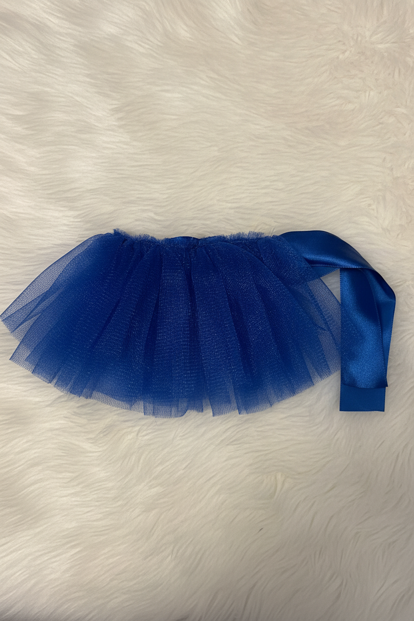 Blue tutu skirt with a satin ribbon on a white fur background