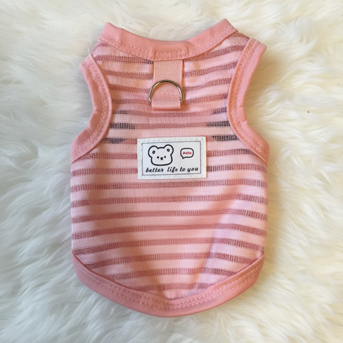 Pink striped pet vest with a label on a fluffy white background