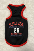 Black pet tank top with red trim and text on a white fluffy background