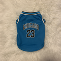 Blue pet jersey with 'Chicago 23' text on a fluffy white surface